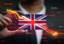 falling stock market in front of United Kingdom flag