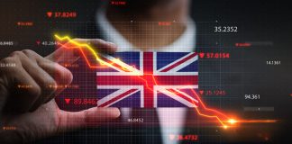 falling stock market in front of United Kingdom flag