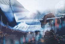 Reasons to Invest in a Business for Sale Businessman holding a pen for financial and business investment