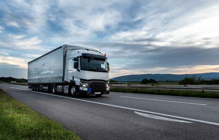 The Advantages of Using Flatbed Trucks for Hauling Heavy Equipment ...