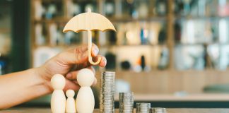 Umbrella icon and family model, Security protection and health insurance. The concept of family home, protection, health care day, car insurance.