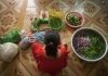 Woman-surrounded-with-vegetables