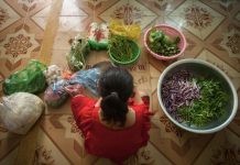 Woman-surrounded-with-vegetables