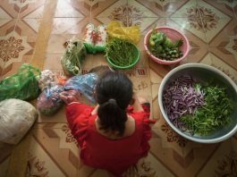 Woman-surrounded-with-vegetables