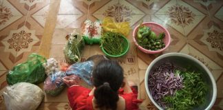 Woman-surrounded-with-vegetables