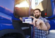 IBC Report Stresses Importance of High Standards for Driving Training in Trucking Industry Truck driver showing his driver license