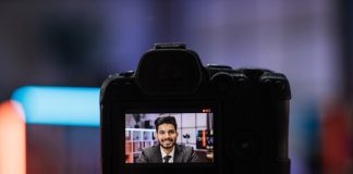 Headshot of a businessman from camera screen