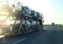 California Car Shipping – Open vs Closed Carrier Cars being transported on a long vehicle car carrier