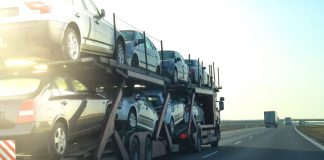 Cars being transported on a long vehicle car carrier