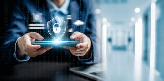 businessman holding a tablet for financial security