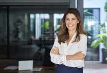 Finance Phantom Review 2024 – Is It a Scam or Does This AI Trading Bot Deliver the Promised Features? Businesswoman standing in office