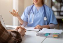 Close-up hand image of a serious patient having a medical consultation with a professional doctor at a hospital