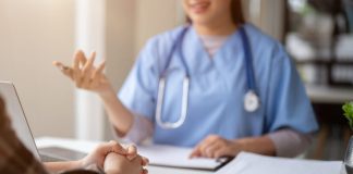 Close-up hand image of a serious patient having a medical consultation with a professional doctor at a hospital