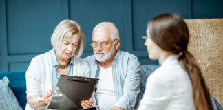Senior couple with consultant at the office