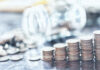 A pile of coins sitting on top of a table