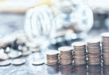 A pile of coins sitting on top of a table