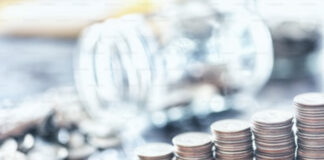 A pile of coins sitting on top of a table