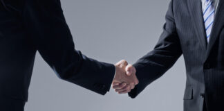 Businessperson shaking hands.