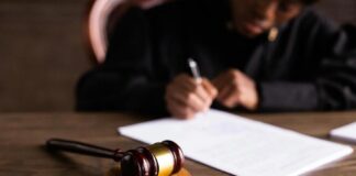 Judge Signing on the Papers