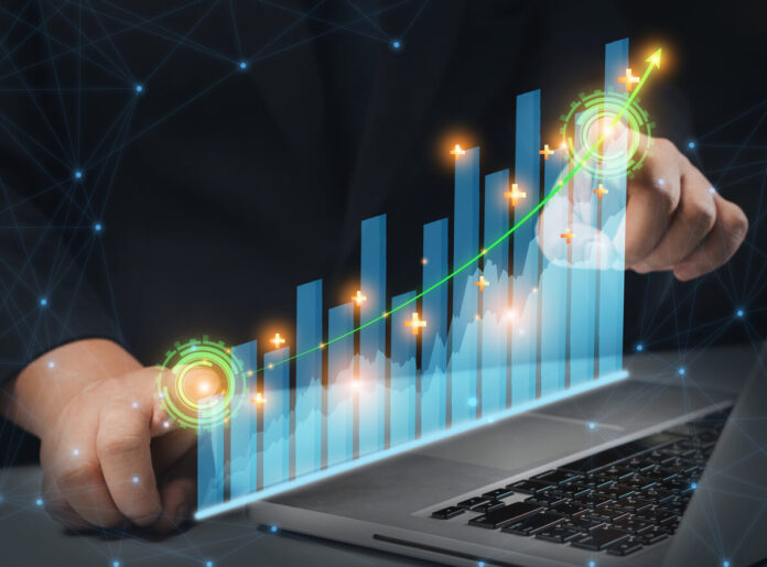 Business man point plan growth increase of positive indicators graph in his business.