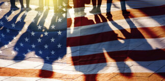 USA Flag and shadows of People
