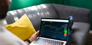 A person trading on a laptop