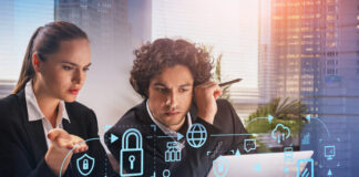 Two thoughtful business people with laptop, blue glowing information protection icons.