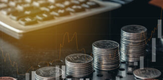 Description Stack of money coin with trading graph for financial investment