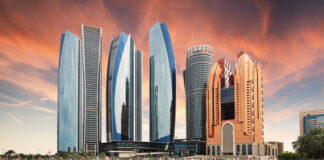 Skyscrapers in Abu Dhabi at dramatic sunset; United Arab Emirates
