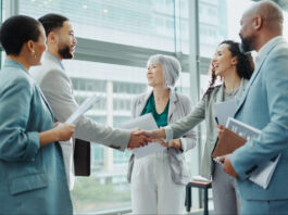 Businessman shaking hands with woman in recruiting for team introduction