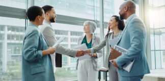Businessman shaking hands with woman in recruiting for team introduction