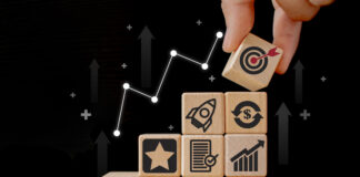 Wooden cubes with icon business strategies, action plan, goal, process, and game plan