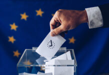 Man throwing his vote into the ballot box