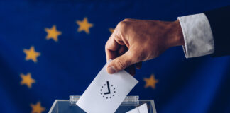 Man throwing his vote into the ballot box