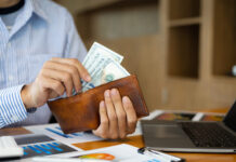 Man holding banknotes counting money