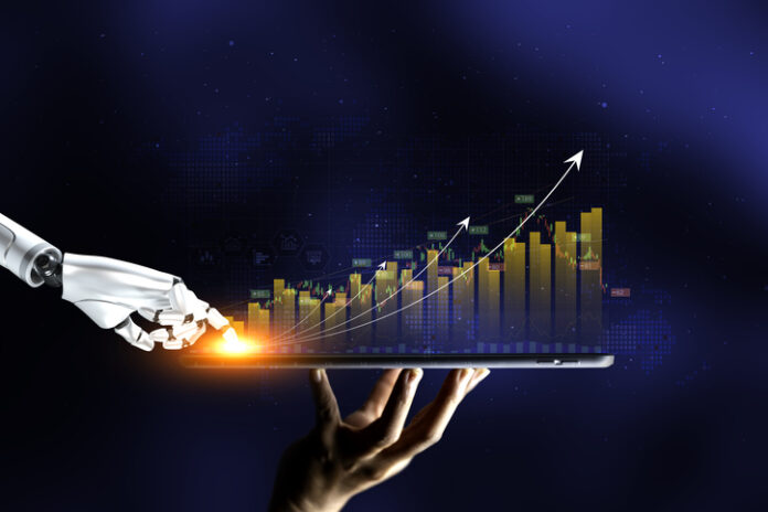 Robot hand represents use of artificial intelligence in trading stocks