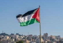 The large Palestinian flag is waiving above the city.