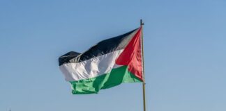 The large Palestinian flag is waiving above the city.