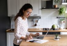 Girl using calculator for budgeting