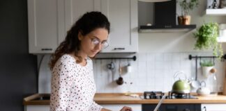 Girl using calculator for budgeting