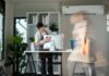 Professional Office Cleaning with Focused Worker and Motion Blur of Colleague in Modern Workspace