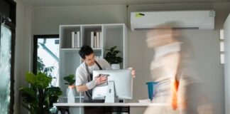 Professional Office Cleaning with Focused Worker and Motion Blur of Colleague in Modern Workspace