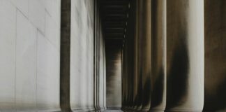 Brown concrete pillar on gray concrete floor