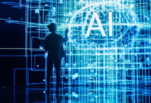 Back View of Woman Holding Laptop Computer, Standing Next To a Big Digital Screen and Interacting with AI Neural Network 3D Visualization.