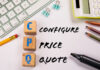 Configure Price Quote. Wooden blocks on a white office table