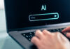 Man using computer with artificial intelligence app. Virtual assistant in digital creative work.