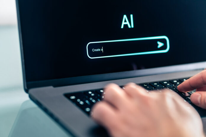 Man using computer with artificial intelligence app. Virtual assistant in digital creative work.