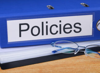 Policies concept with word on the folder.