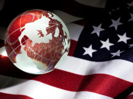 Image of the American flag with the earth superimposed