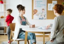 ADHD child's therapist talk with mother and ask questions during first session
